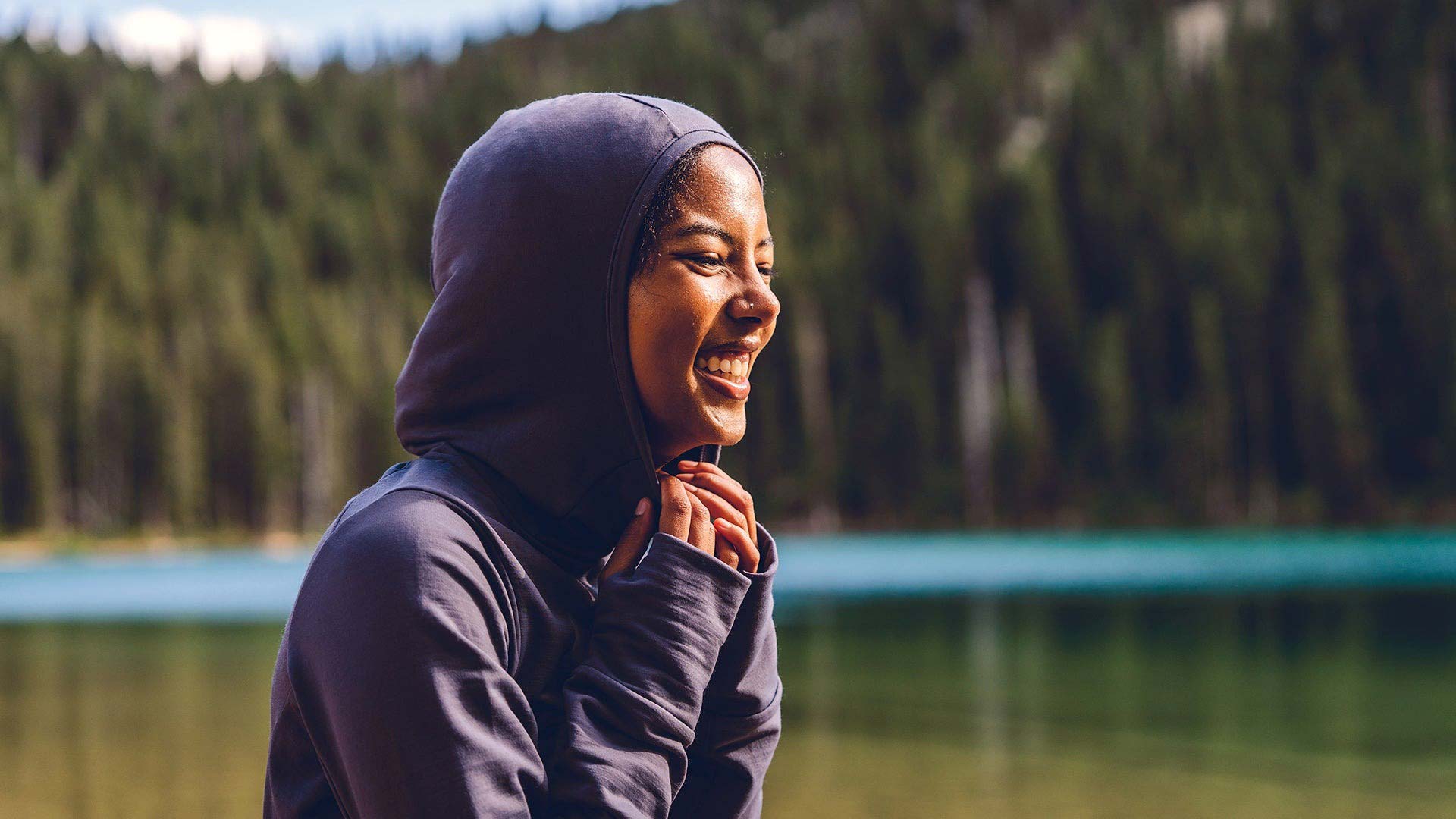 woman smiling wearing hoodie